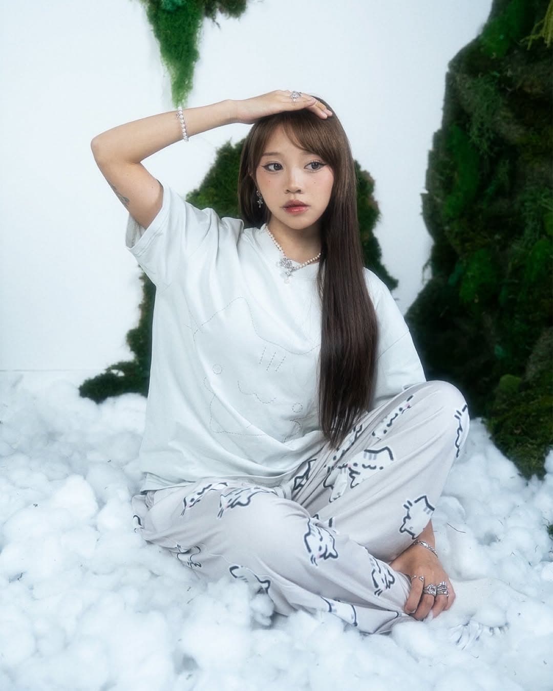 Sunny posed in a bright studio set for a cat merch drop collaboration.