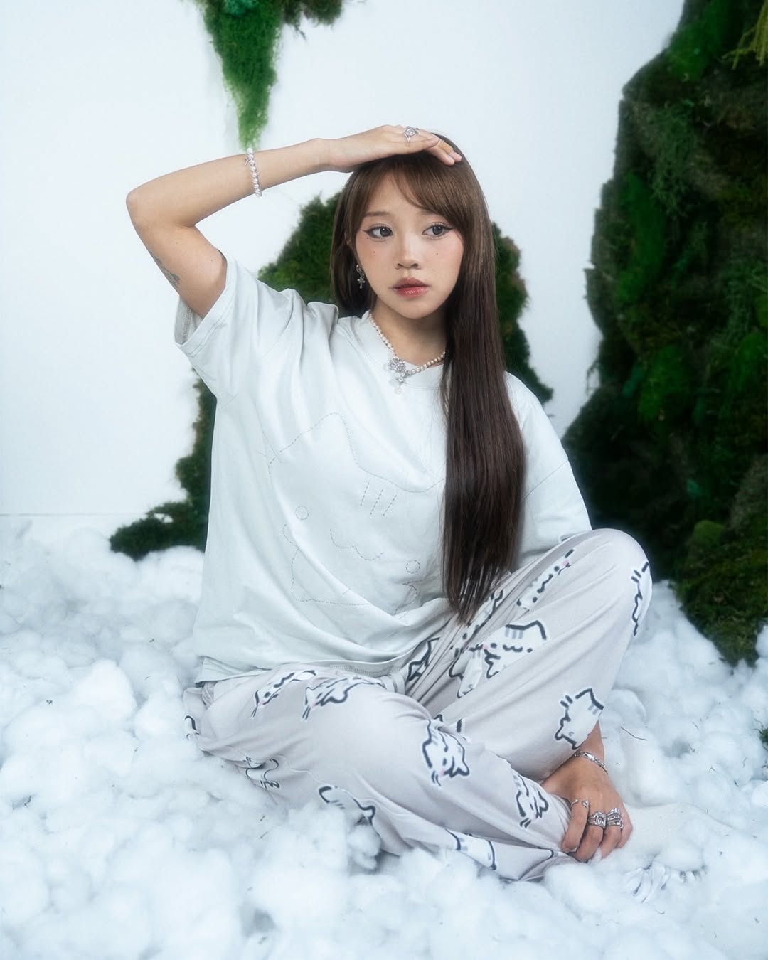 Sunny styled for a Basiilleafs cat merch drop in a soft white set.
